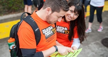 male and female looking at a clue sheet